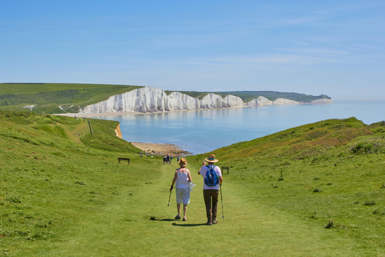 A couple walking near the Seven Sisters in Sussex