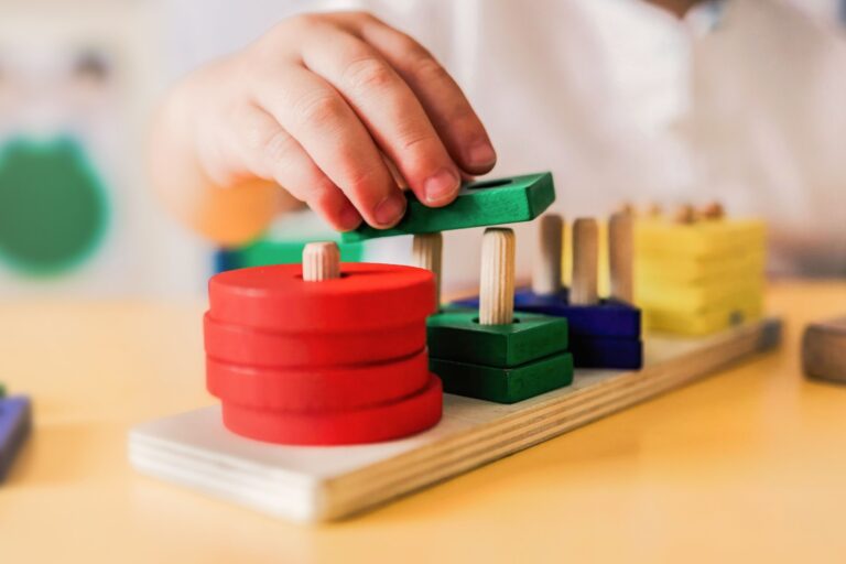 A child playing with wooden shapes.