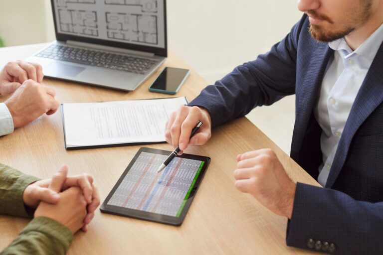 A couple speaking to a mortgage adviser.